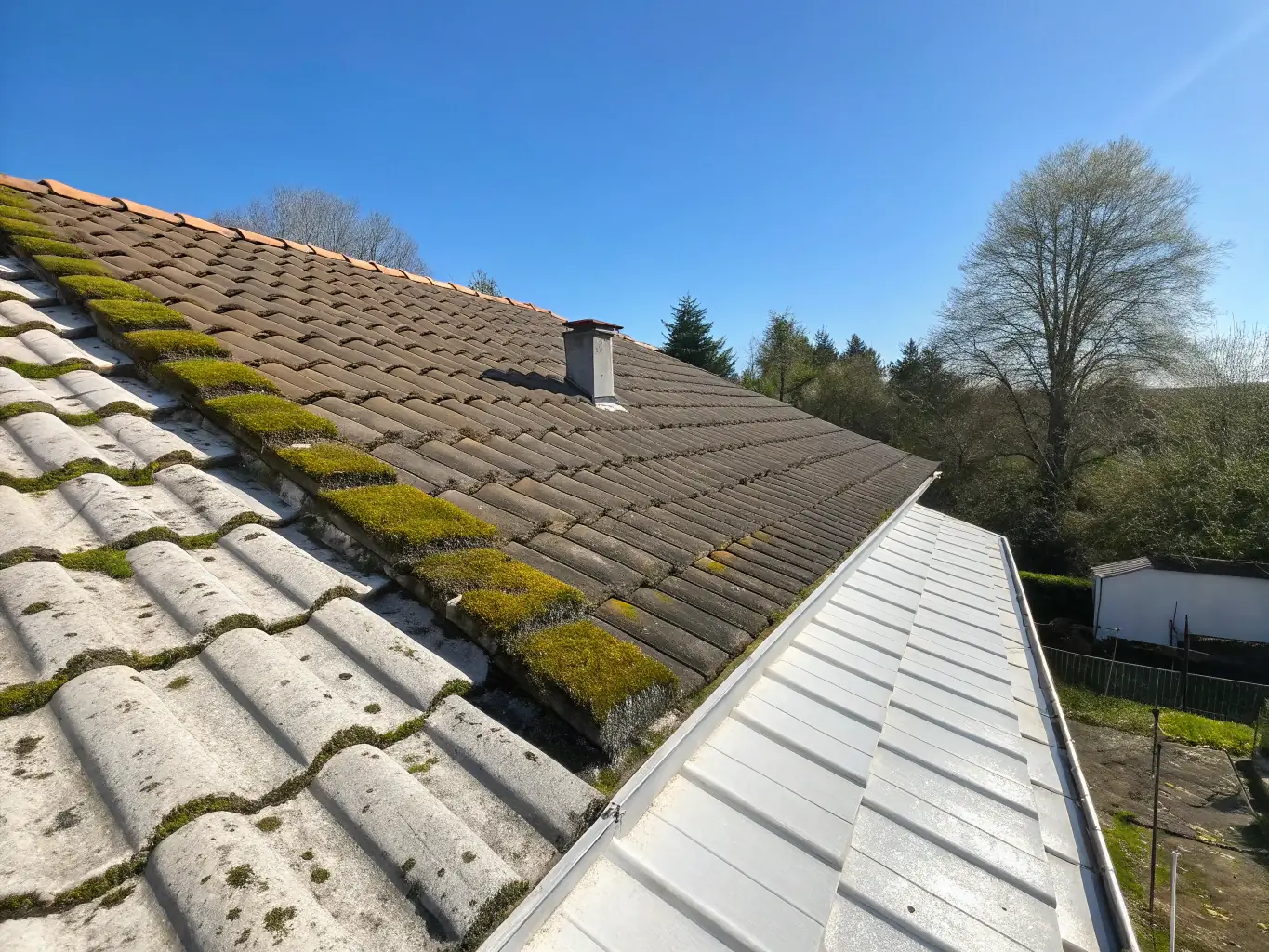 A before-and-after image showcasing the effectiveness of NanoRevive's cleaning services, with a visibly cleaner and brighter roof on the 'after' side.